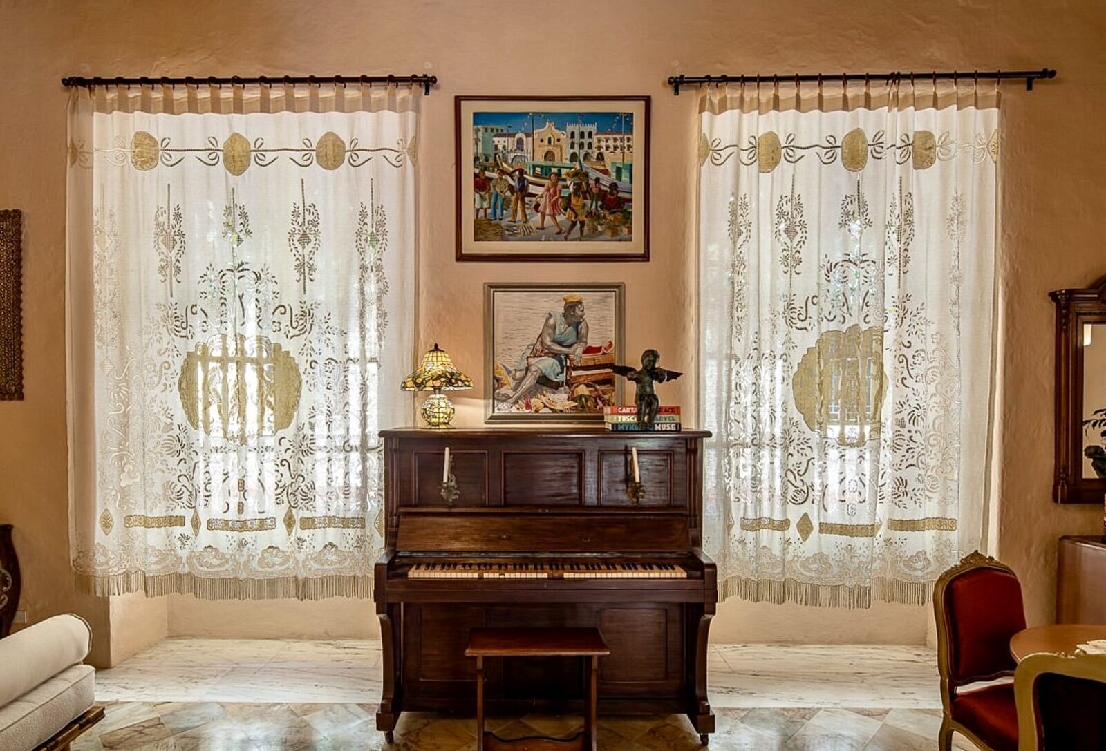 Handmade embroidered linen curtains in an elegant living room with piano