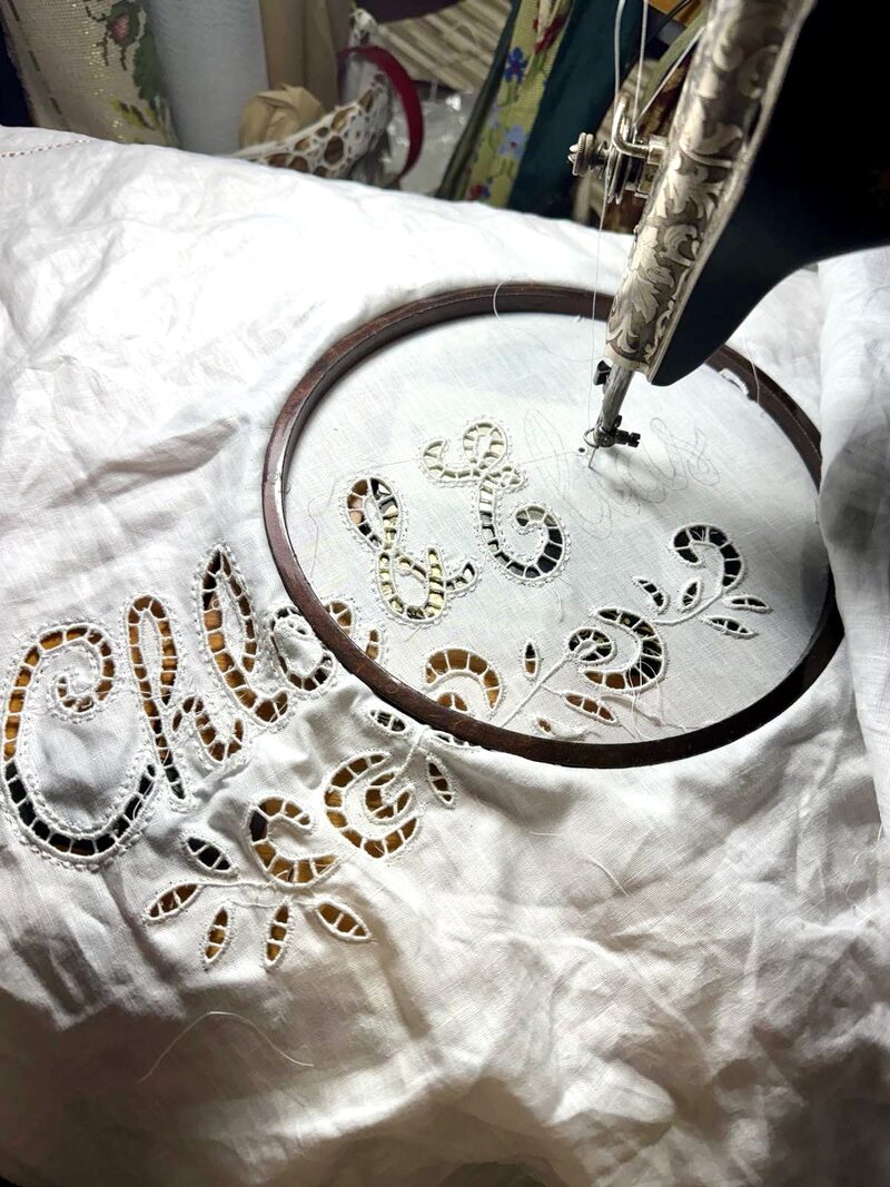 Cutwork embroidery in progress on embroidery hoop with traditional techniques