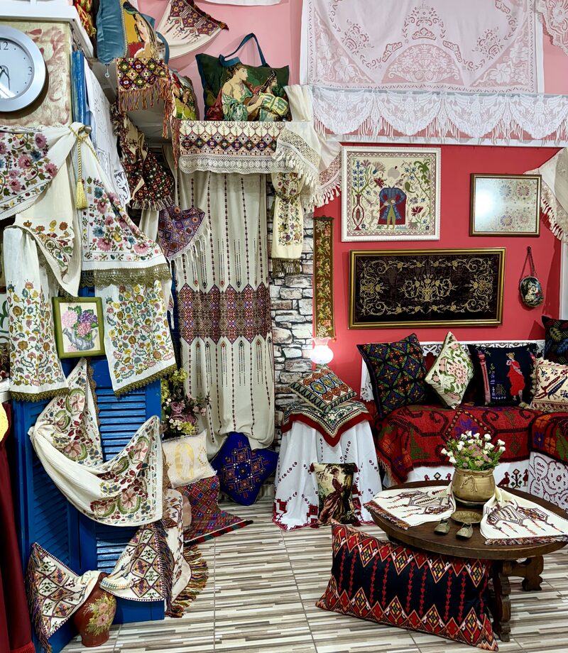 Interior of the Embroider Riches workshop in Athens filled with vintage textiles and embroidered pieces