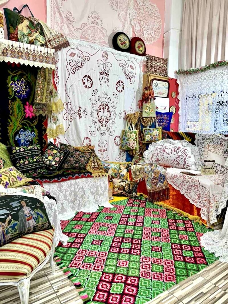 Embroider Riches Athens workshop interior with handmade cutwork embroidery and vintage textiles